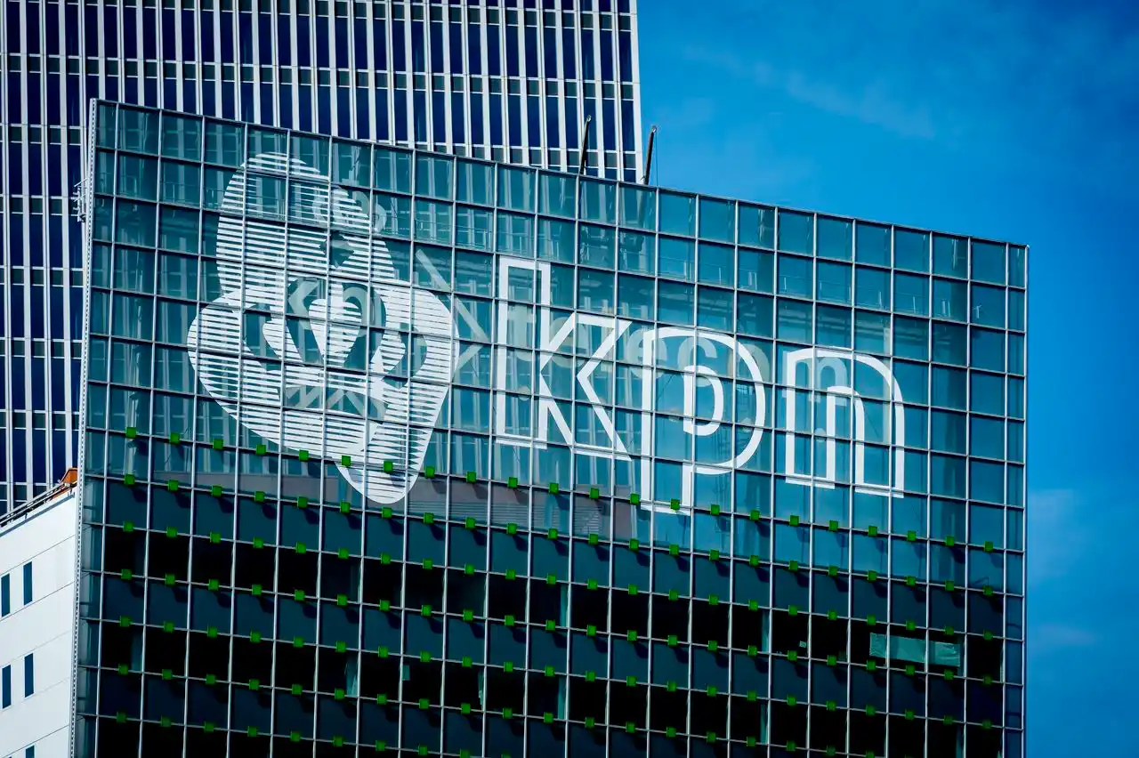 a glass building with a KPN logo on it